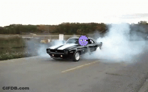 A Black Car With A Purple Ghost On The Back Is Drifting Down The Road GIF