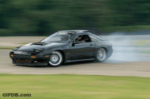 A Black Car With A Sticker On The Windshield That Says ' Rx7 ' On It GIF