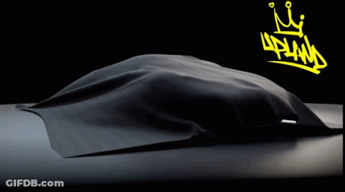 A Black Car With A Yellow Crown And The Word Upland On The Bottom GIF