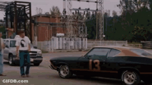 A Black Car With The Number 13 On It GIF