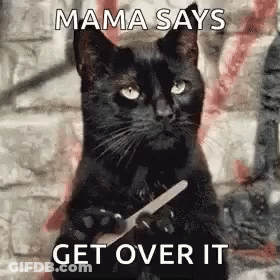 A Black Cat Is Holding A Knife In Its Paws And Says Mama Says Get Over It . GIF