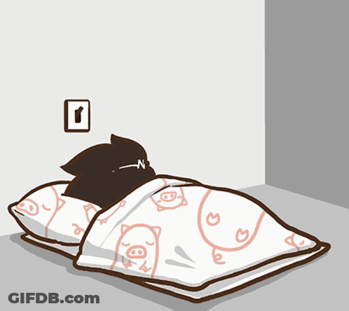 A Black Cat Is Laying On A Bed With A Blanket With Pigs On It GIF