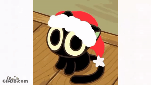 A Black Cat Wearing A Santa Hat Is Laying On A Wooden Floor GIF