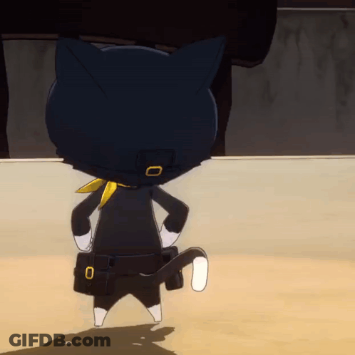 A Black Cat With A Yellow Scarf Around Its Neck Is Standing On A Sandy Surface GIF