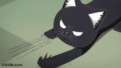 A Black Cat With White Ears Is Laying Down With Its Claws Out GIF