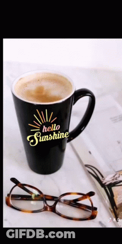 A Black Coffee Mug That Says Hello Sunshine On It GIF