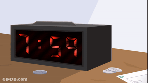 A Black Digital Clock Displays The Time As 11:59 GIF