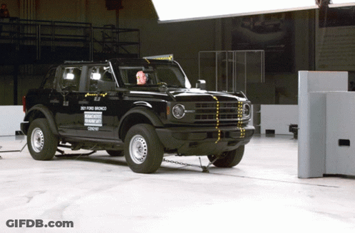 A Black Ford Bronco Is Being Tested In A Building GIF