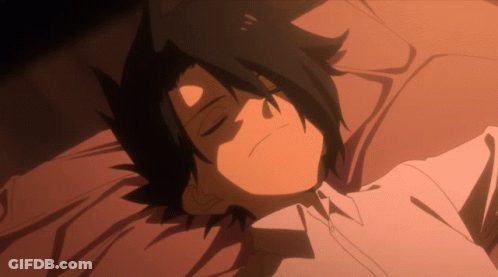 A Black Haired Anime Character Is Laying Down With His Eyes Closed GIF
