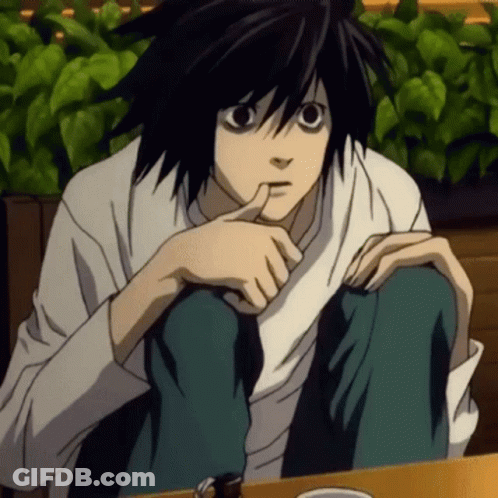A Black Haired Anime Character Sitting At A Table With His Hand On His Chin GIF