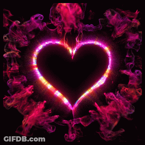 A Black Heart Is Surrounded By A Rainbow Colored Smoke Ring GIF
