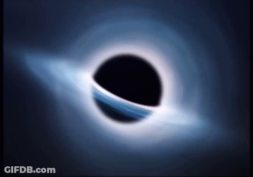A Black Hole With A Blue Ring Around It In The Dark GIF