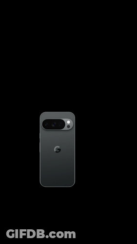 A Black Iphone Is Sitting On A Black Surface . GIF