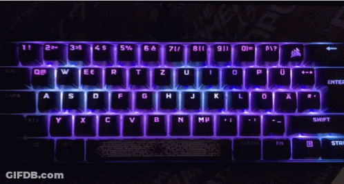 A Black Keyboard With Purple Letters And Numbers GIF