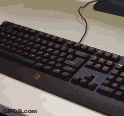 A Black Keyboard With The Letter R On The Bottom Right GIF