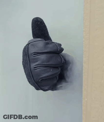 A Black Leather Glove Is Giving A Thumbs Up GIF