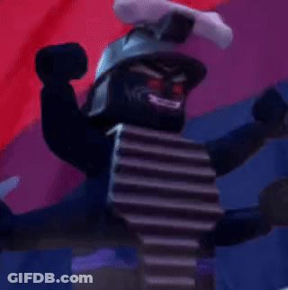 A Black Lego Figure With Red Eyes And A Sword On Top Of His Head GIF
