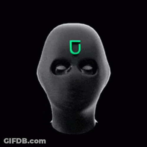 A Black Mask With A Green Letter U On It GIF