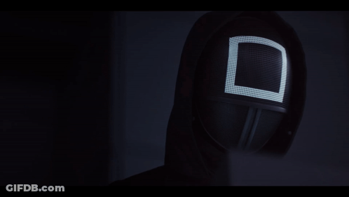 A Black Mask With A White Square On It GIF