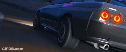 A Black Nissan Sports Car Is Driving Down A Road GIF