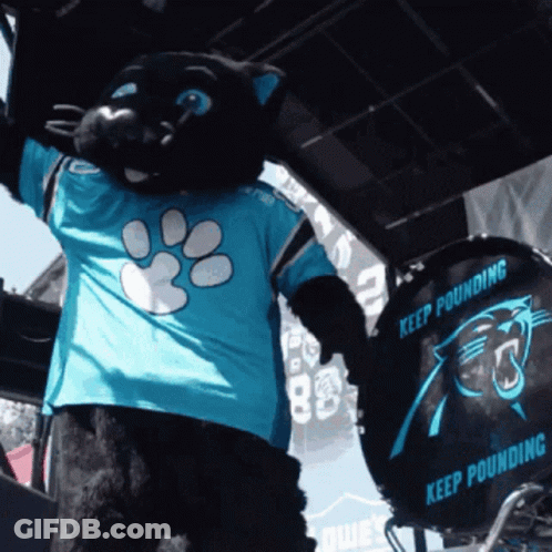 A Black Panther Mascot Wearing A Blue Shirt That Says " Keep Pounding " GIF
