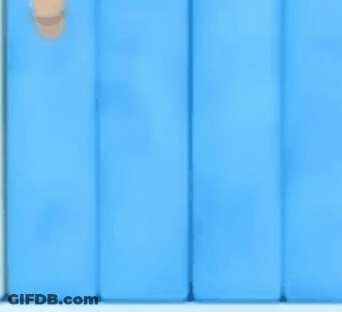 A Black Penguin With A Red Beak And White Eyes GIF