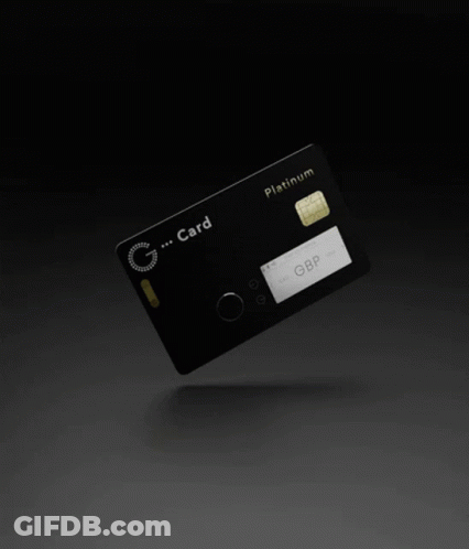 A Black Platinum Credit Card With A Gold Chip GIF
