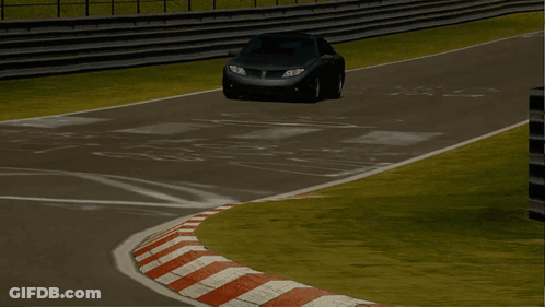 A Black Pontiac Car Is Driving Down A Road GIF