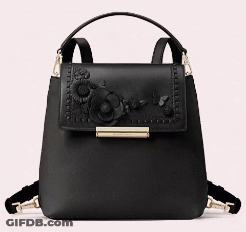 A Black Purse With Flowers On It And The Word Kate Spade On The Front GIF