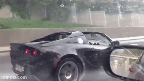 A Black Sports Car With A License Plate That Says L.j.o. On It GIF