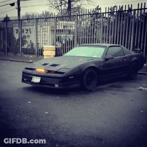 A Black Sports Car With A License Plate That Says Tnc 929 GIF