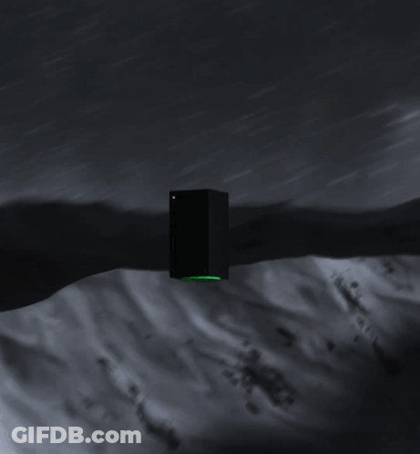 A Black Xbox With A Green Controller On The Side GIF