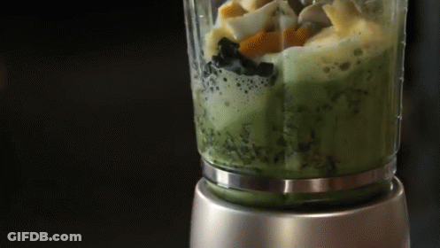 A Blender Is Filled With A Green Smoothie GIF