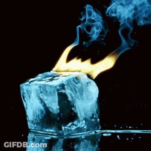 A Block Of Ice Is Being Lit Up By A Flame . GIF