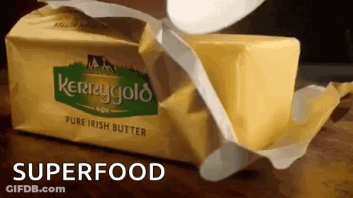 A Block Of Kerrygold Pure Irish Butter Being Opened GIF