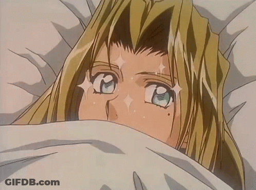 A Blonde Anime Character Is Laying In Bed With A White Blanket GIF