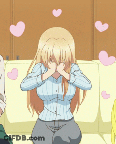 A Blonde Anime Girl Covering Her Face With Her Hands With Pink Hearts Flying Around Her GIF