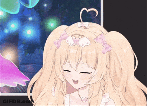 A Blonde Anime Girl With A Heart In Her Hair Is Making A Funny Face GIF