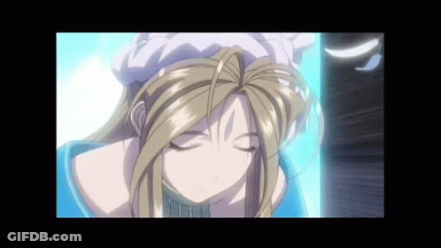 A Blonde Anime Girl With Her Eyes Closed And A White Hat On Her Head GIF
