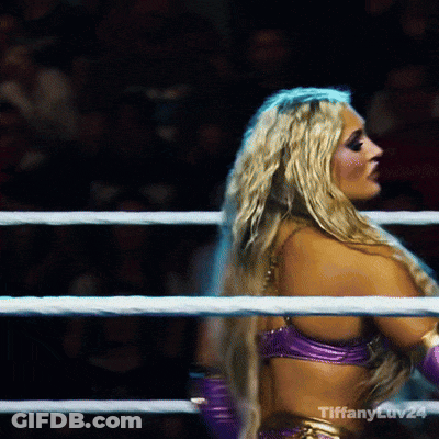 A Blonde Woman In A Purple Top Is In A Boxing Ring With Tiffany Ev24 Written On The Bottom Right GIF