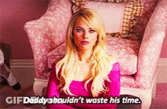 A Blonde Woman Is Sitting In A Pink Chair And Says Daddy Shouldn 'T Waste His Time GIF