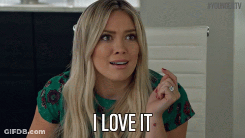 A Blonde Woman Says I Love It In A Green Shirt GIF