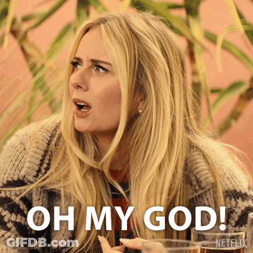 A Blonde Woman Says Oh My God While Holding A Glass Of Wine GIF