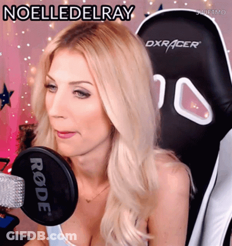 A Blonde Woman Sitting In A Dxracer Chair With The Name Noelledelray Written Above Her GIF