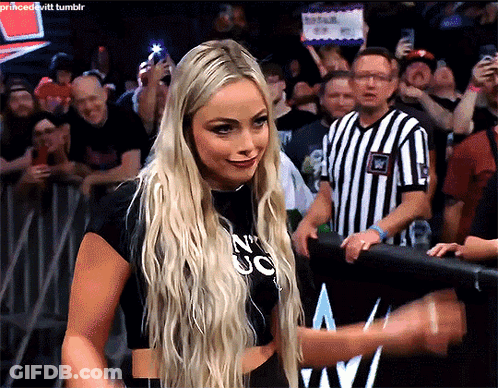 A Blonde Woman Wearing A Black Shirt That Says N ' Uc On It GIF