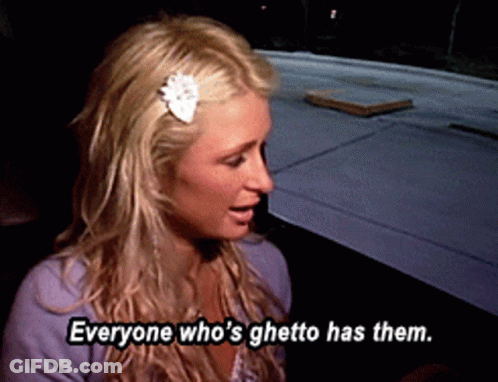 A Blonde Woman With A Flower In Her Hair Says Everyone Who 'S Ghetto Has Them GIF