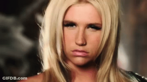 A Blonde Woman With A Nose Ring Is Making A Serious Face GIF