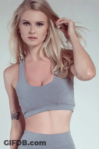 A Blonde Woman With A Tattoo Of A Butterfly On Her Arm GIF
