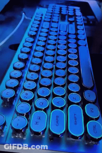 A Blue And Black Keyboard With A Shift Key In The Middle GIF