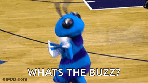 A Blue And Purple Mascot Is Dancing On A Basketball Court And Asking What 'S The Buzz ? GIF